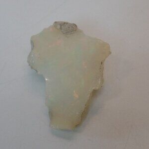 Opal Rock Shaped Like Africa Weighs 2.1 Grams Apx 3/4" Wide X 1" Long Glows